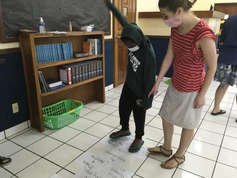 Students learn the Scripture through "Bible Memory Hopscotch".